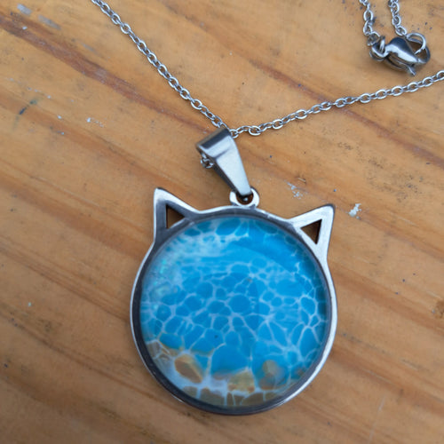 Beautiful blue cat pendant inspired by ocean depths. Stainless steel with 17" chain