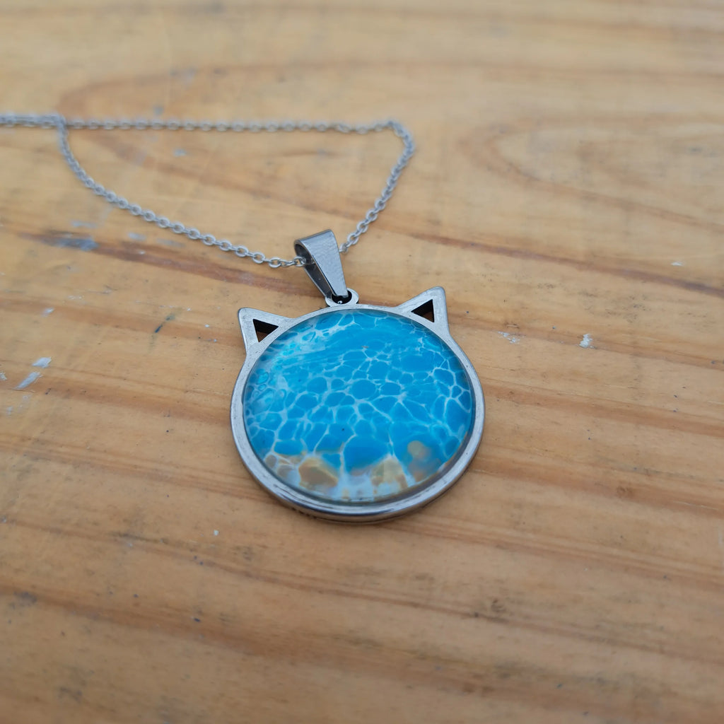 Beautiful blue cat pendant inspired by ocean depths. Stainless steel with 17" chain