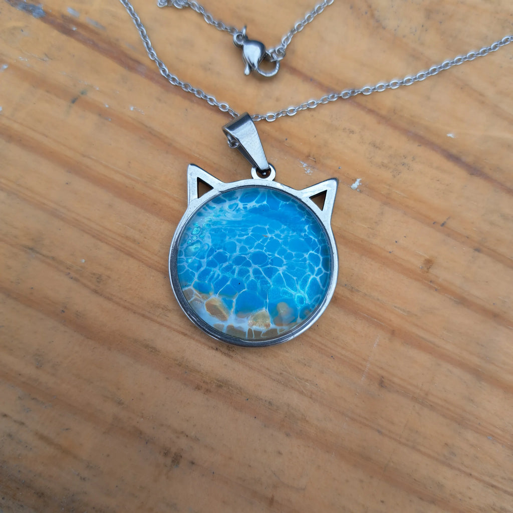 Beautiful blue cat pendant inspired by ocean depths. Stainless steel with 17" chain
