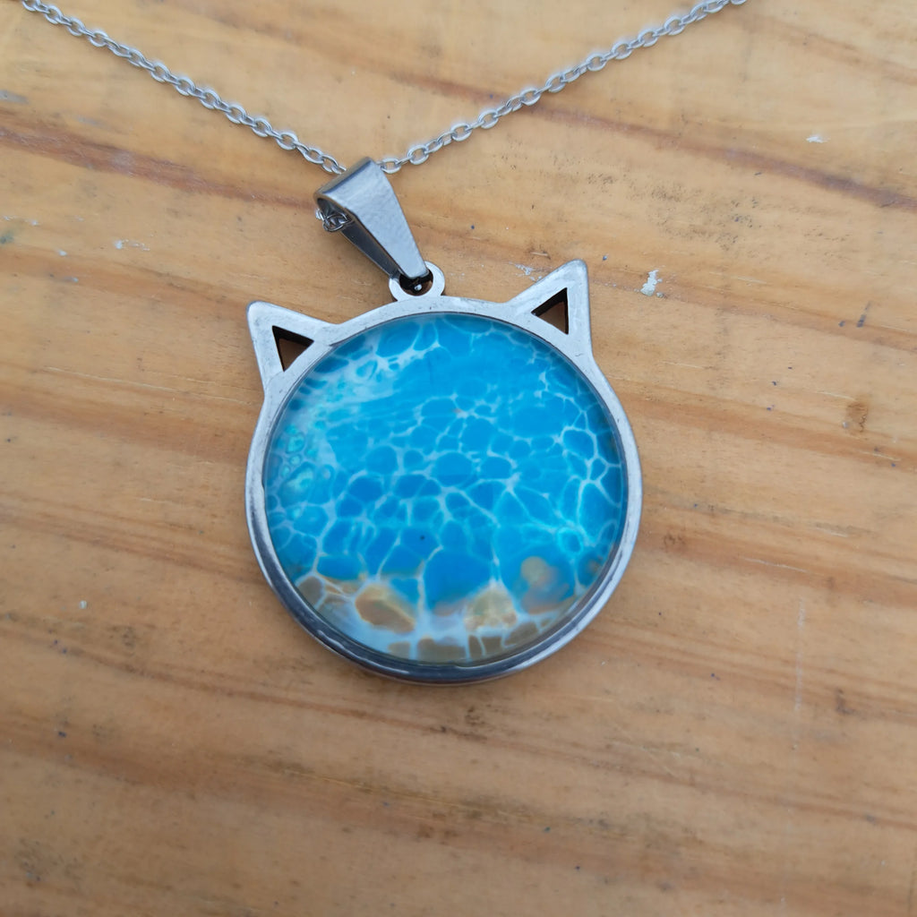 Beautiful blue cat pendant inspired by ocean depths. Stainless steel with 17" chain
