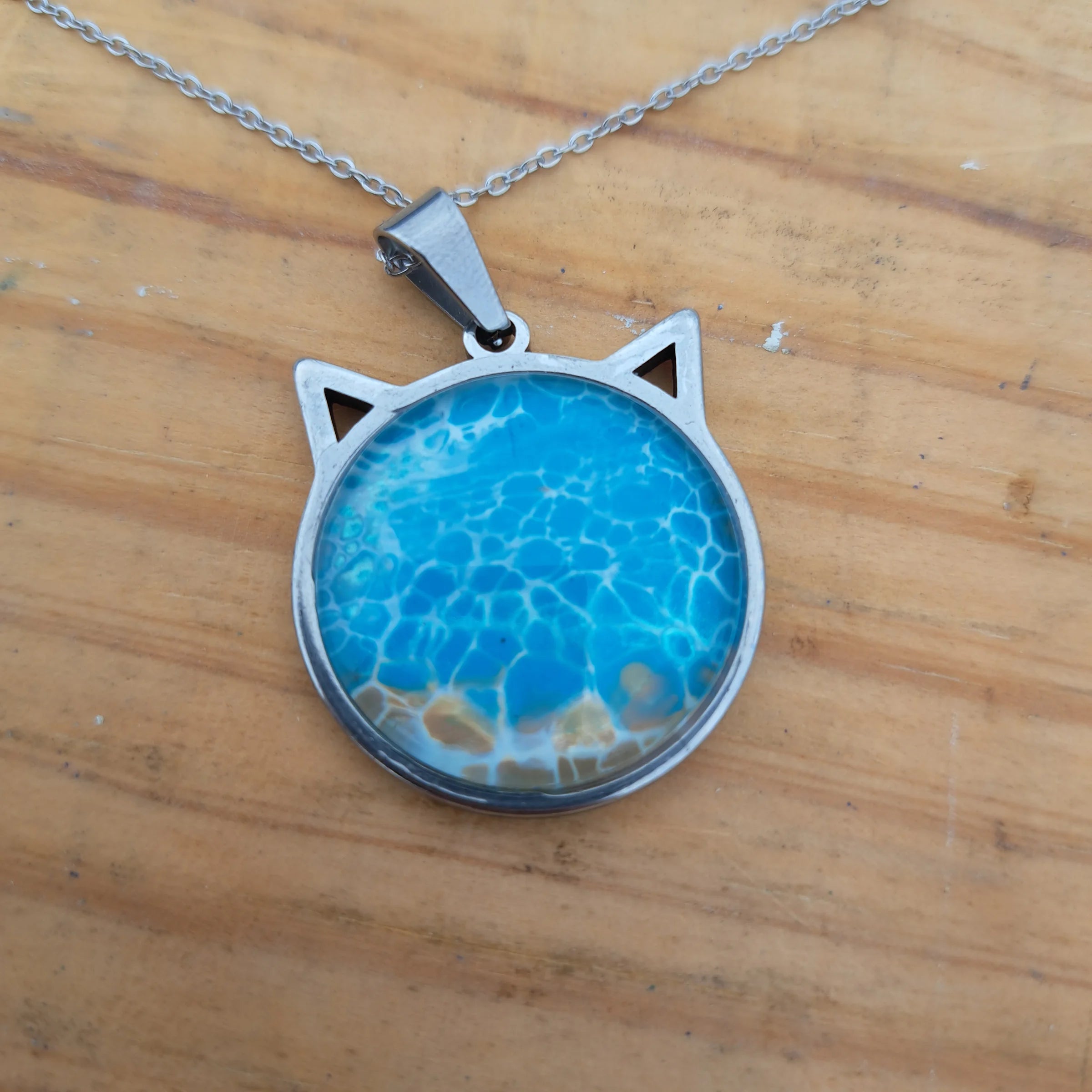 Beautiful blue cat pendant inspired by ocean depths. Stainless steel with 17" chain