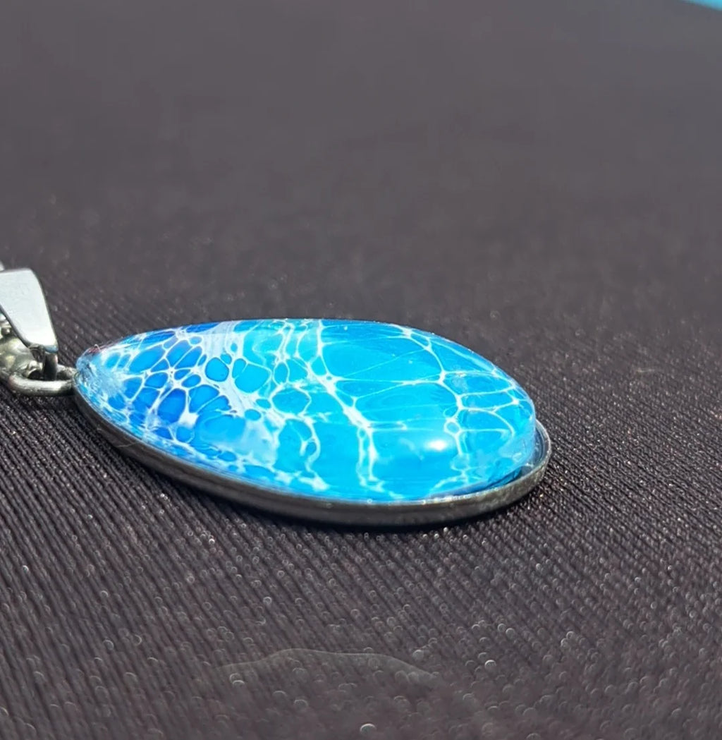 Beautiful hand-painted ocean wave teardrop pendant in blue & white. Stainless steel, 17" chain. Coastal artisan jewelry. 